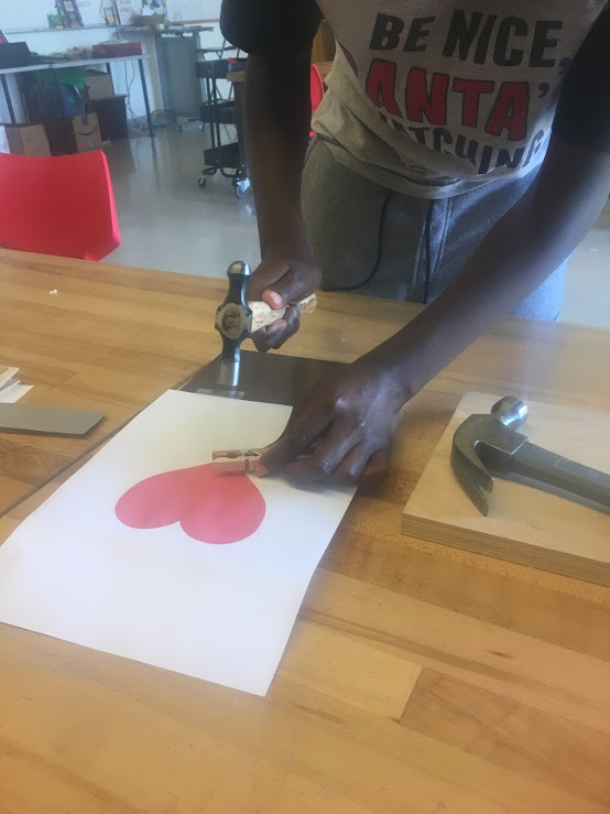 Student Hammering Nails