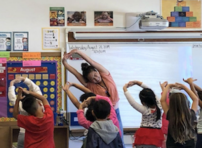 Students stretching in class