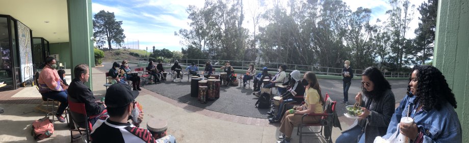 Mentors and mentees sit together at Visitacion Valley Middle School