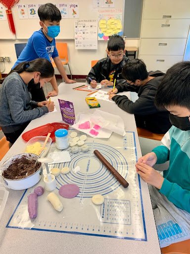 Students making mooncakes 2023