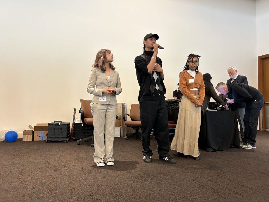 Students introducing themselves at event