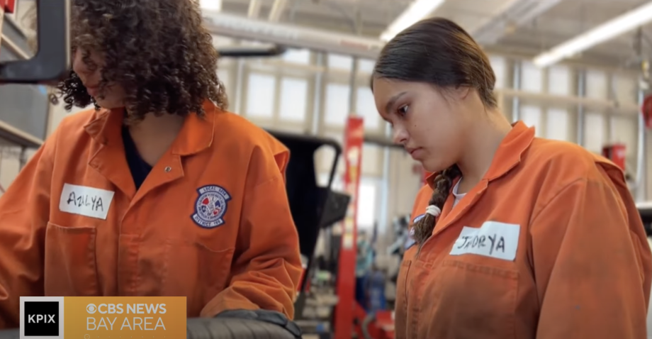 Two high school students participating in the Auto Summer Career Exploration Program at George Washington High School
