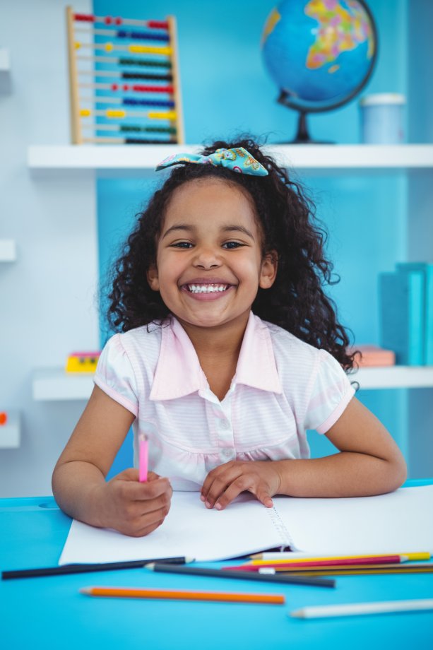 Girl drawing in her notebook