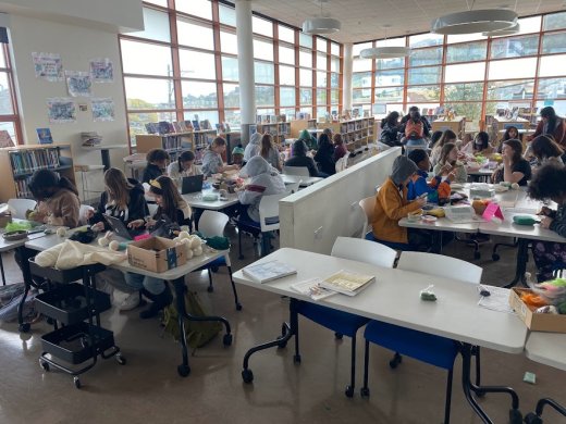 Students making crafts in the WIllie Brown Jr library makerspace