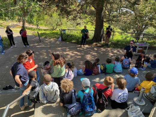Students listen in on an Environmental Solutionary Fellow presentation at the Randall Museum.