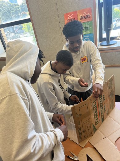 Black Star Rising Freedom Academy students work on a project