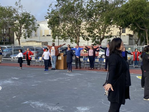 Rosa Parks staff, students, and JBBP celebration attendees participate in Radio Taiso, a traditional Japanese stretching routine.