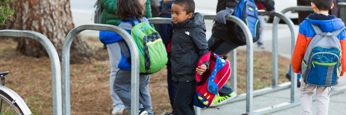 Elementary school students with backpacks