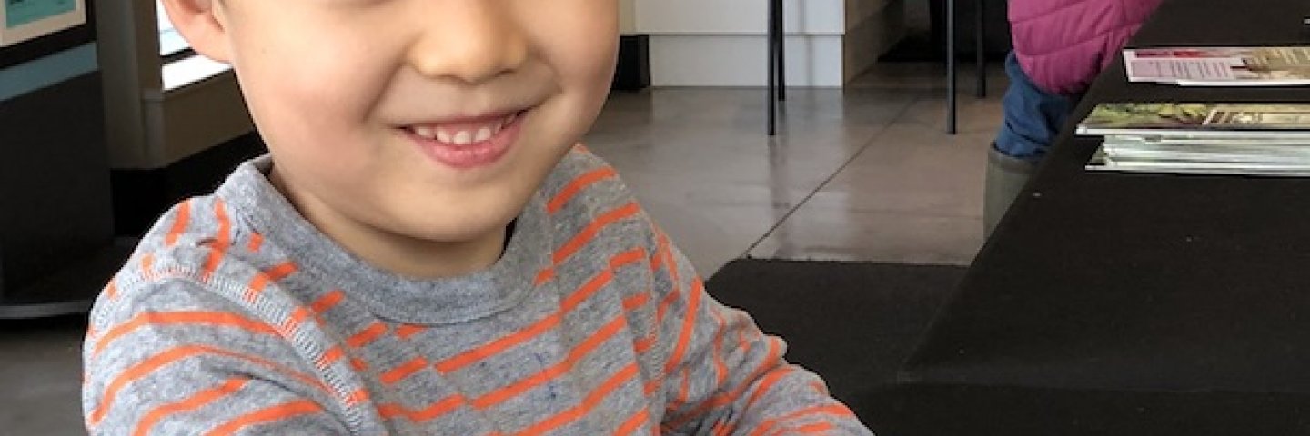 boy holding a bug