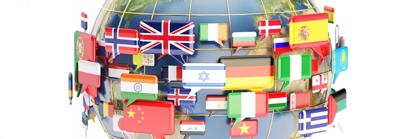Globe surrounded by speech bubbles containing flags of many countries