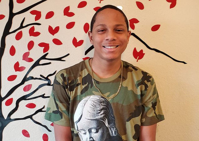 8th grade student posing for a photo