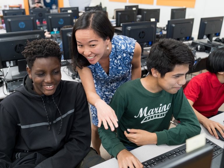 Teacher and students at a computer