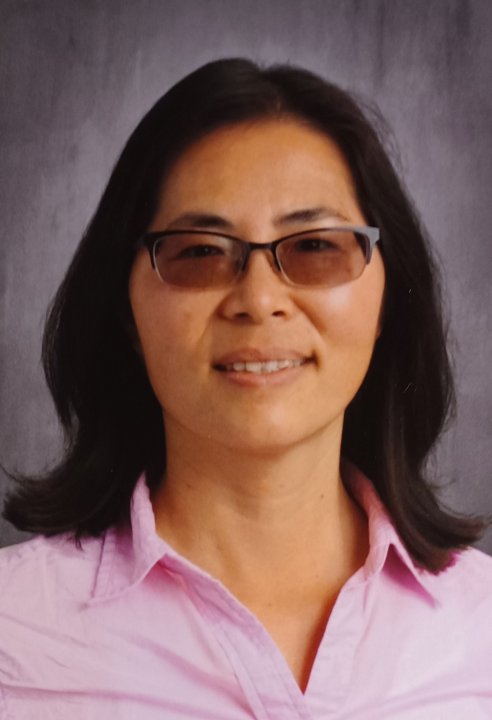 Ms. Sharon in a pink shirt