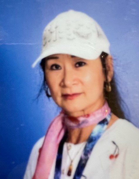 Ms, Melinda TK Para wearing a white hat