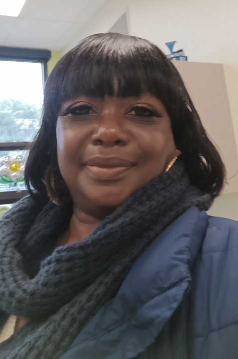 Ms. Theresa Brown wearing a blue scarf