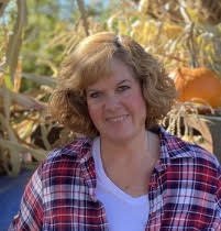 Ms. Martha with a cornfield in the background
