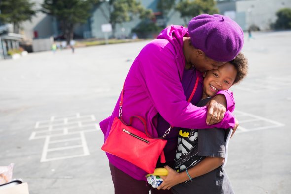 Mother hugging child