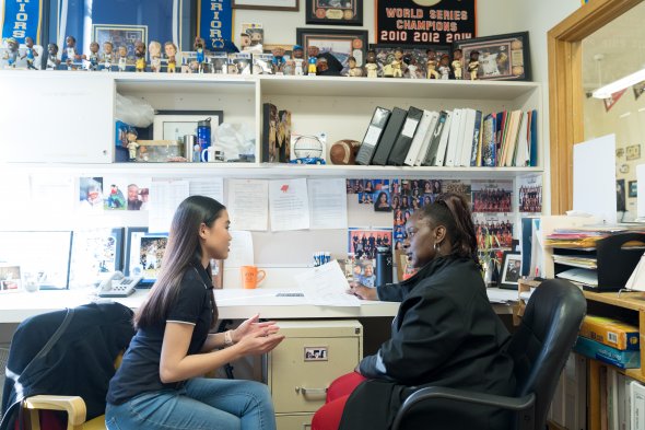 High school student and counselor talking