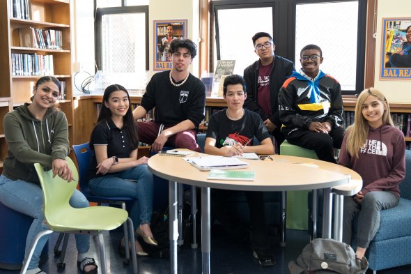 7 high school students around a table