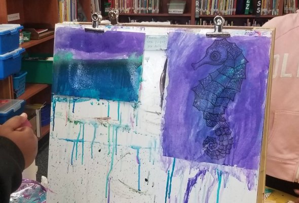 Students' watercolor paintings.