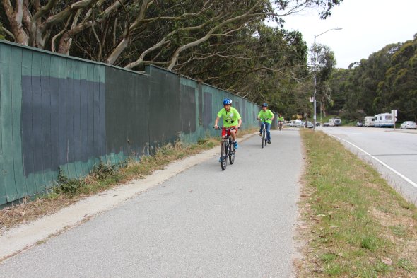 Students riding bikes around lake merced 