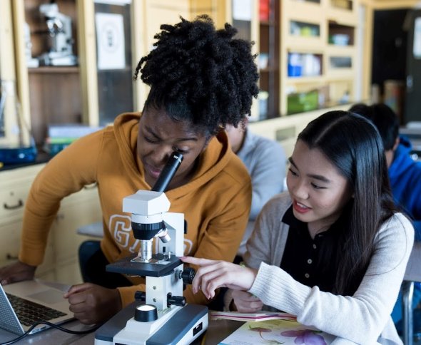 Student using a microscope