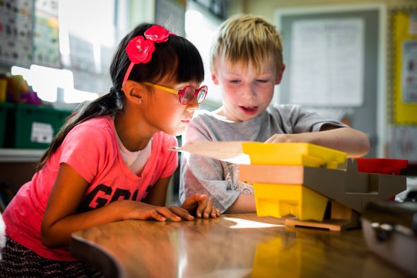 Two students doing science