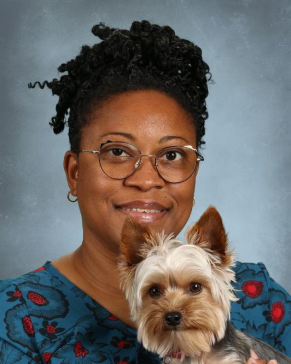 headshot with yorkie dog & a light grey background