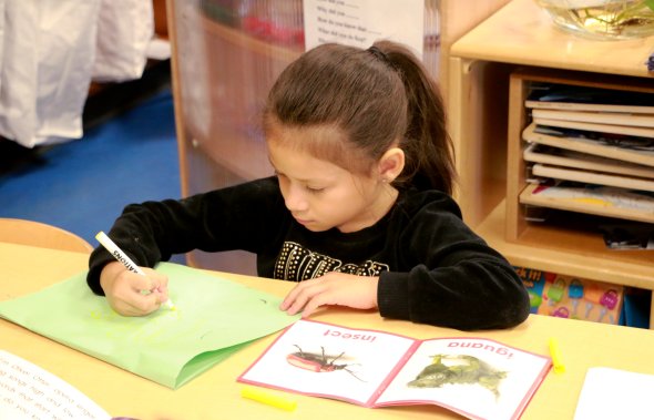 TK student completing assignment