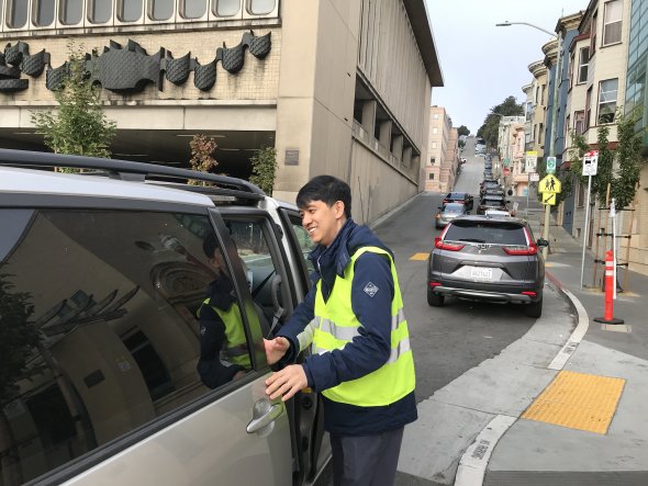 man helping child from van