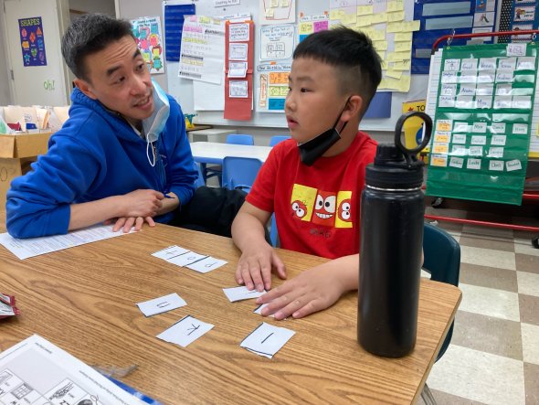 Teacher with student