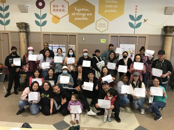 Group of adults holding certificates