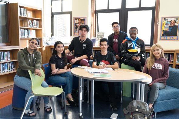 Group of students at a table in the library