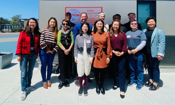 Group photo including Asian PAC members, Superintendent, Board Members, AAAA, and TACT.