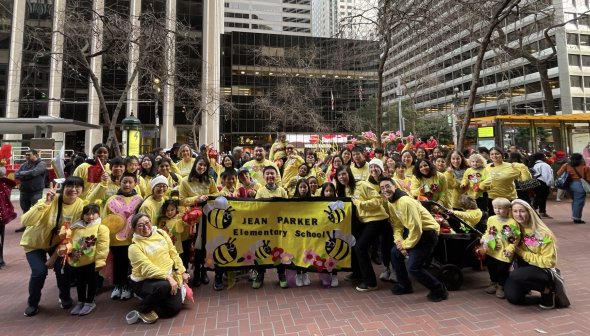 Large group smiling at Chinese New Year Parade