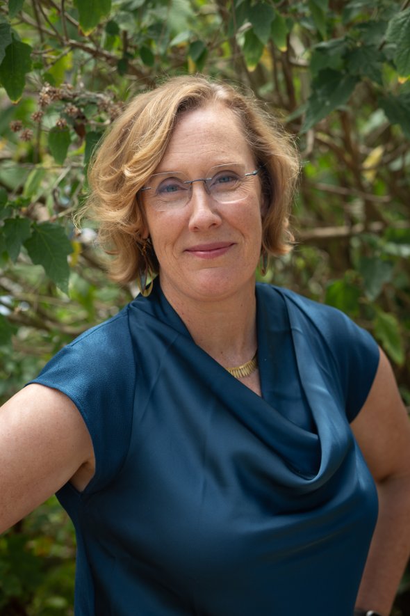 Smiling white woman with short blonde hair