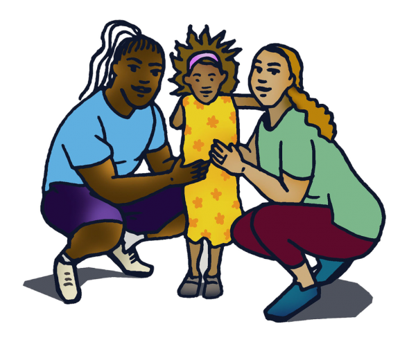 Two adults crouching down next to a young girl; a family