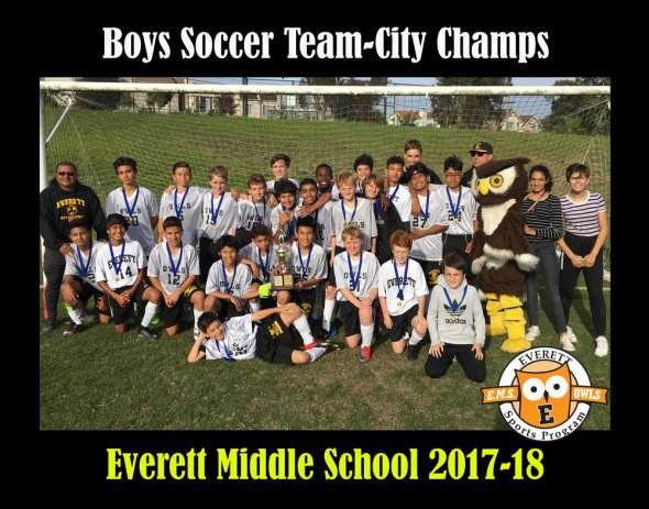 Boys soccer players posing for team photo