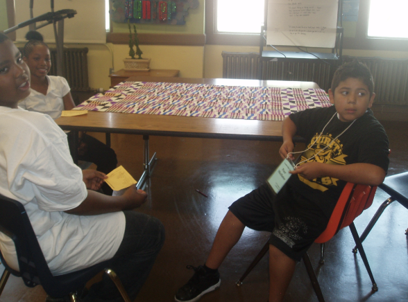 Three students working to resolve a conflict