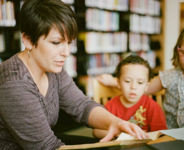 Mother reading with child