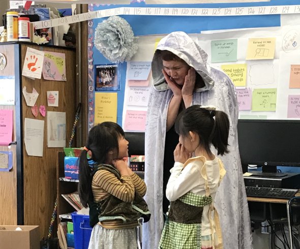 sing a story teacher with two students