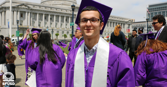 Galileo High School student Zahir in graduation cap and gown