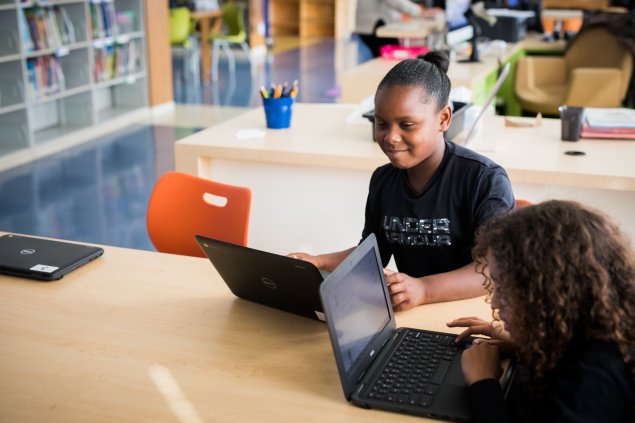 Two students on laptops