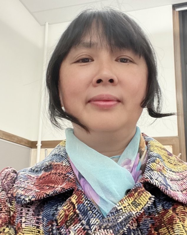 Asian woman in colorful coat