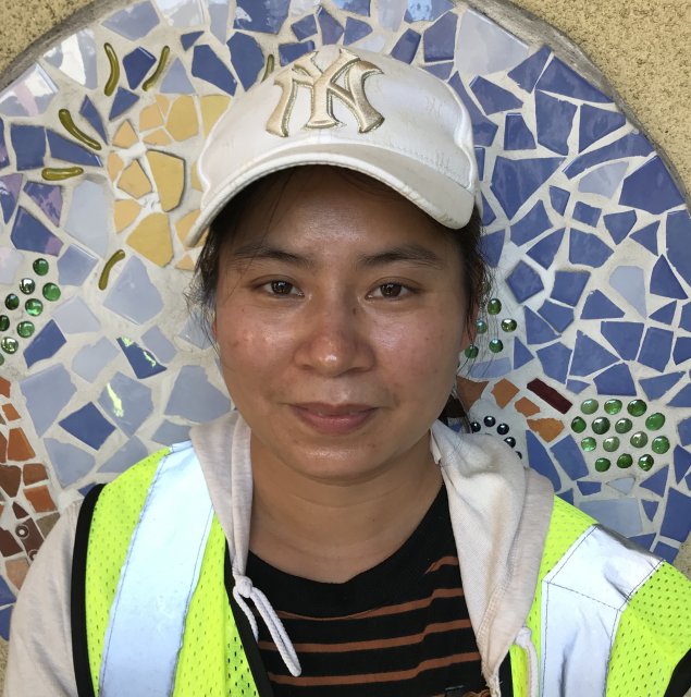 Asian woman with hat on