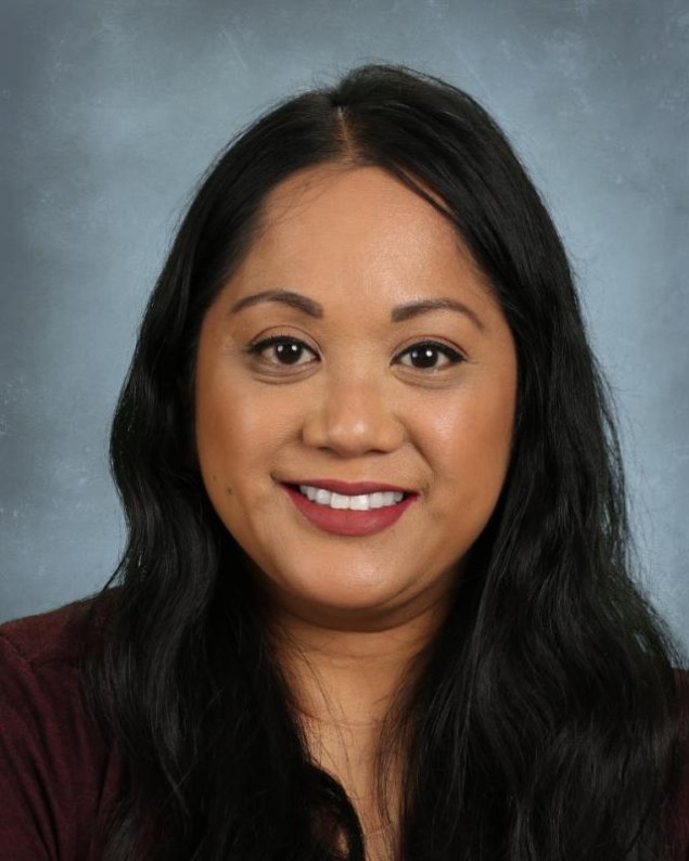 headshot with a light grey background