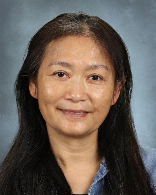 headshot with a light grey background
