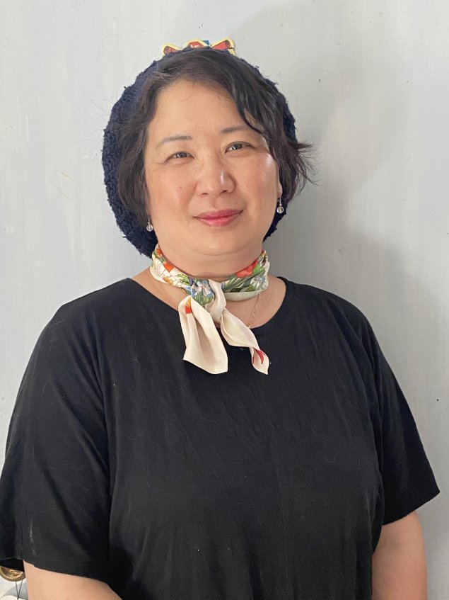 Asian woman with hat on