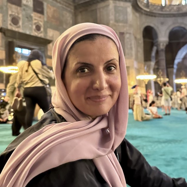 smiling woman with head covering