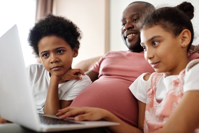 Graphic combining the Department of Technology's logo and a family using a laptop